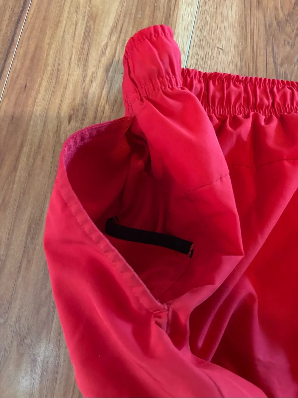 c-1 Nike Men’s Bright Red Athletic Shorts with White Swoosh.